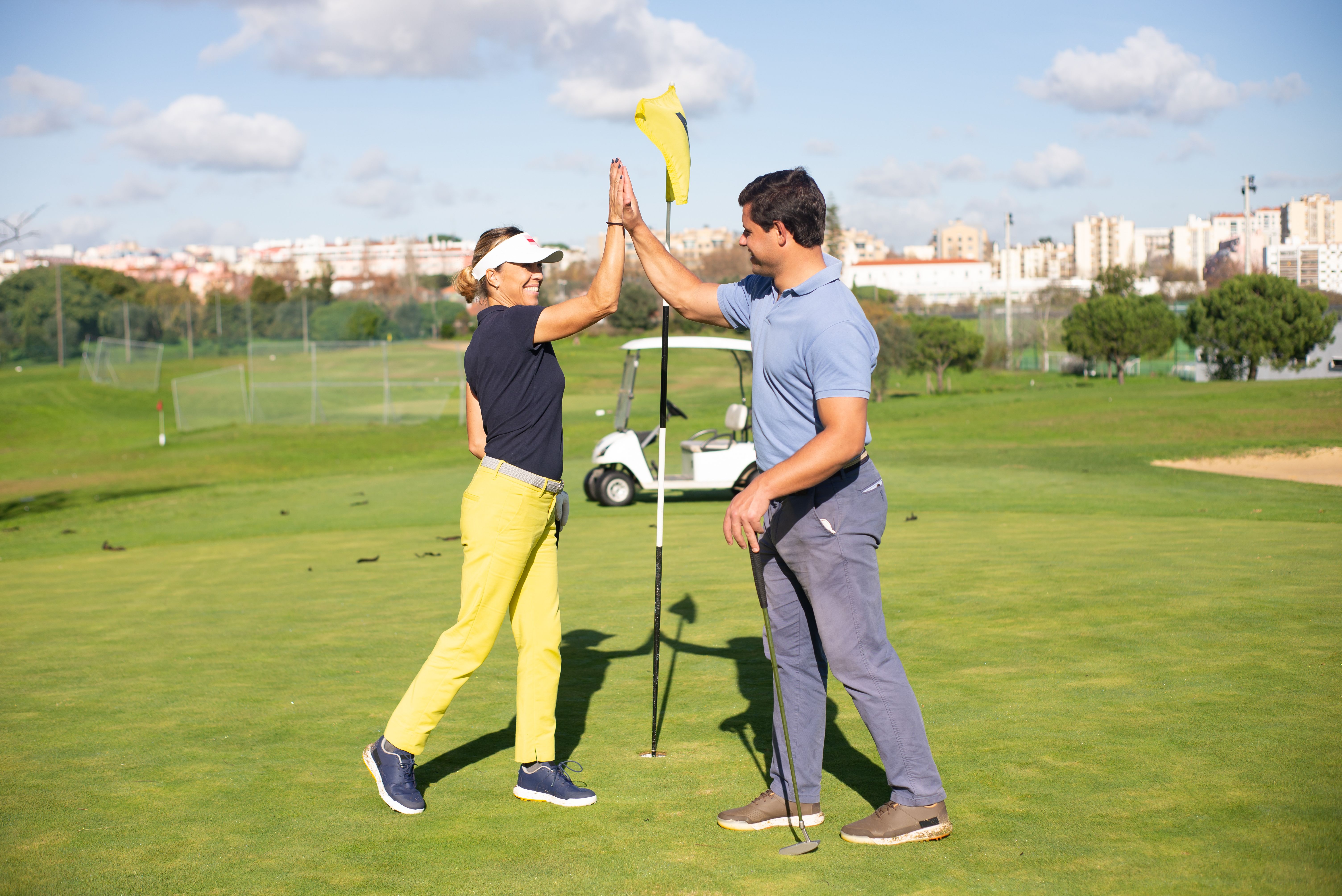 Golfers celebrating together on the course